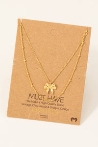 Gold Dipped Knotted Ribbon Bow Pendant Necklace