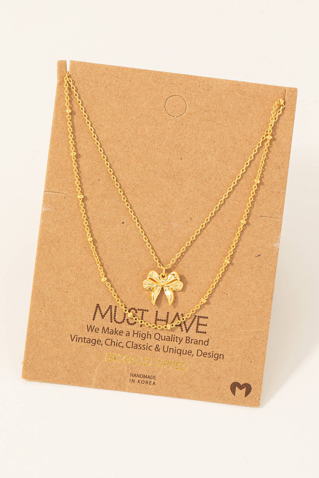 Gold Dipped Knotted Ribbon Bow Pendant Necklace